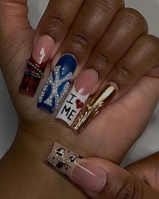Mixed-media long nail set in burgundy, royal blue, white, and gold with crystals and charms
