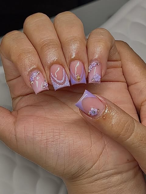 Short square lilac nail set with delicate linework, bows, and 3D floral details