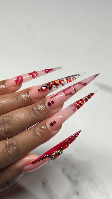 Extra-long stiletto nail set in pink and red with hearts and crystal accents
